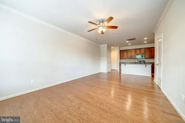 a view of a kitchen with a sink and a window