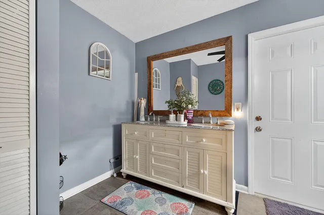 a room with mirror and window