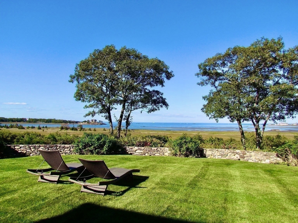 24 Wood Island Road Scituate, MA 02066 - Photo 4 of 42 a view of a garden with an outdoor space and seating area