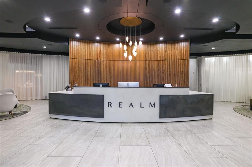 3324 Peachtree Road Northeast, Unit 2507 Atlanta, GA 30326 - Photo 2 of 25 a bathroom with a sink a large mirror and a shower