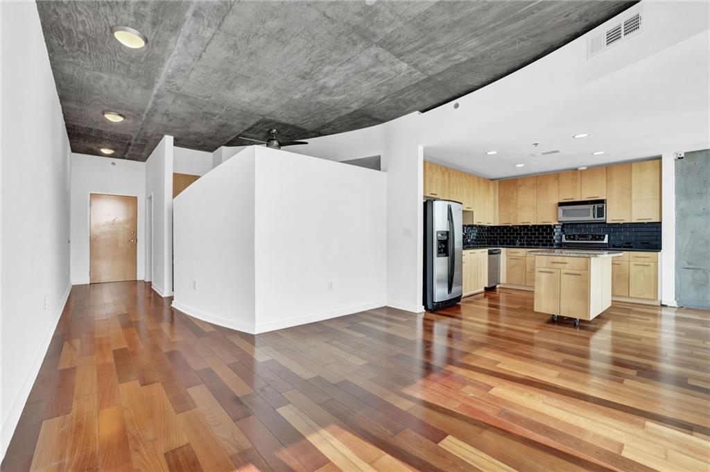 3324 Peachtree Road Northeast, Unit 2507 Atlanta, GA 30326 - Photo 10 of 25 a view of kitchen with stainless steel appliances refrigerator and microwave