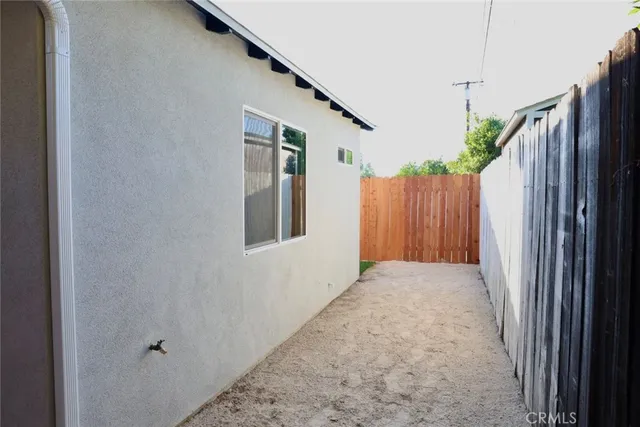 a view of a house with a backyard space