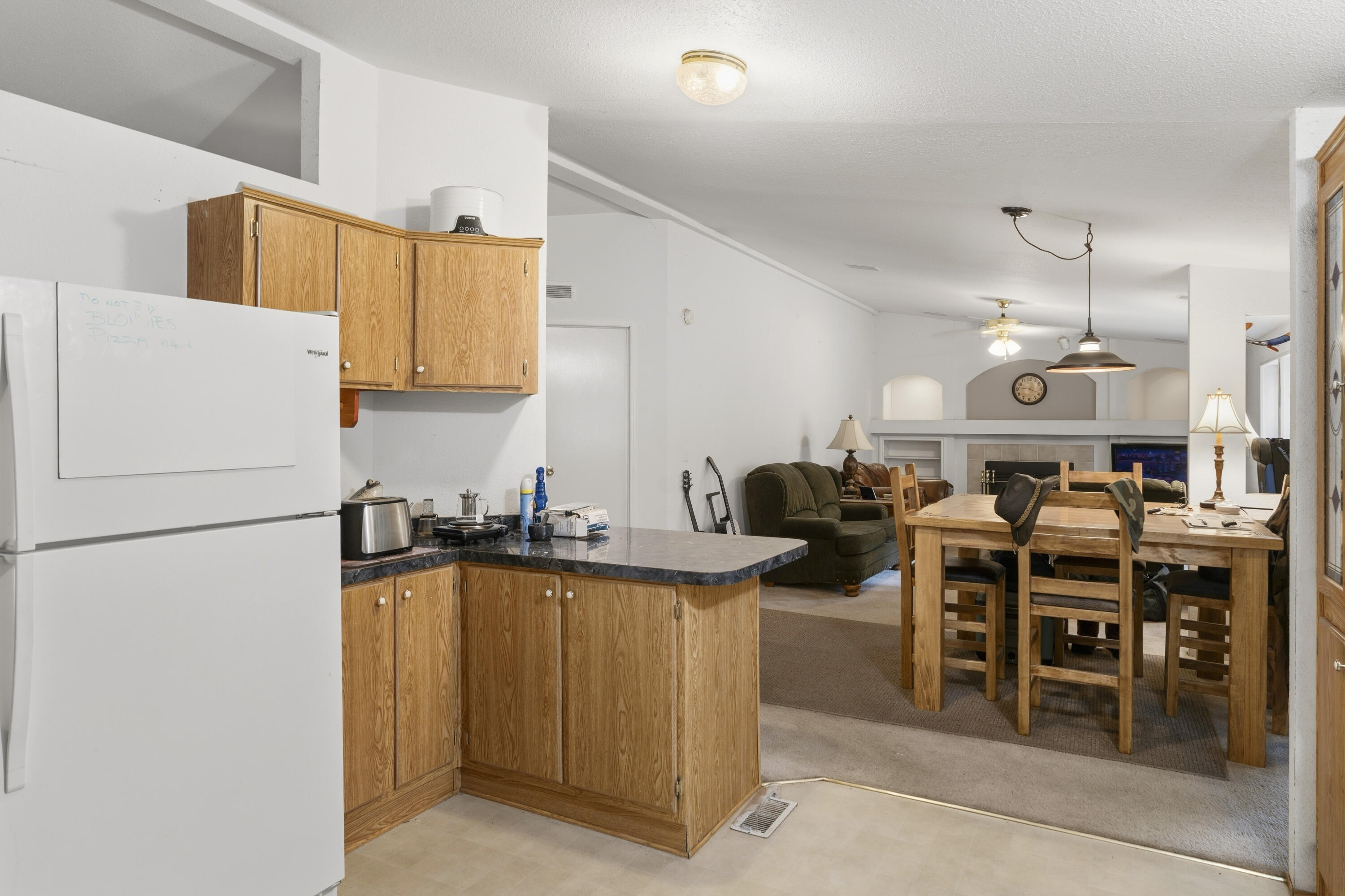 16928 Covina Road Bend, OR 97707 - Photo 16 of 48 a kitchen with lots of counter space and appliances