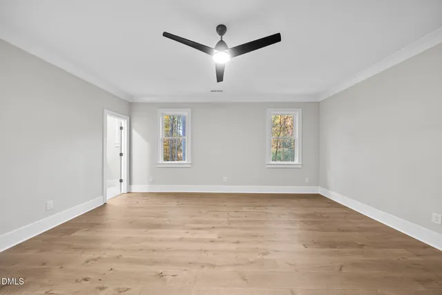 a view of swimming pool with a yard and large tree