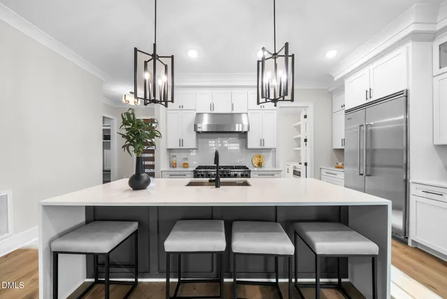 a view of kitchen with furniture cabinet and window