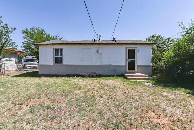 1110 46th Street Lubbock, TX 79412 - Photo 10 of 10 a view of a house with a yard and garage