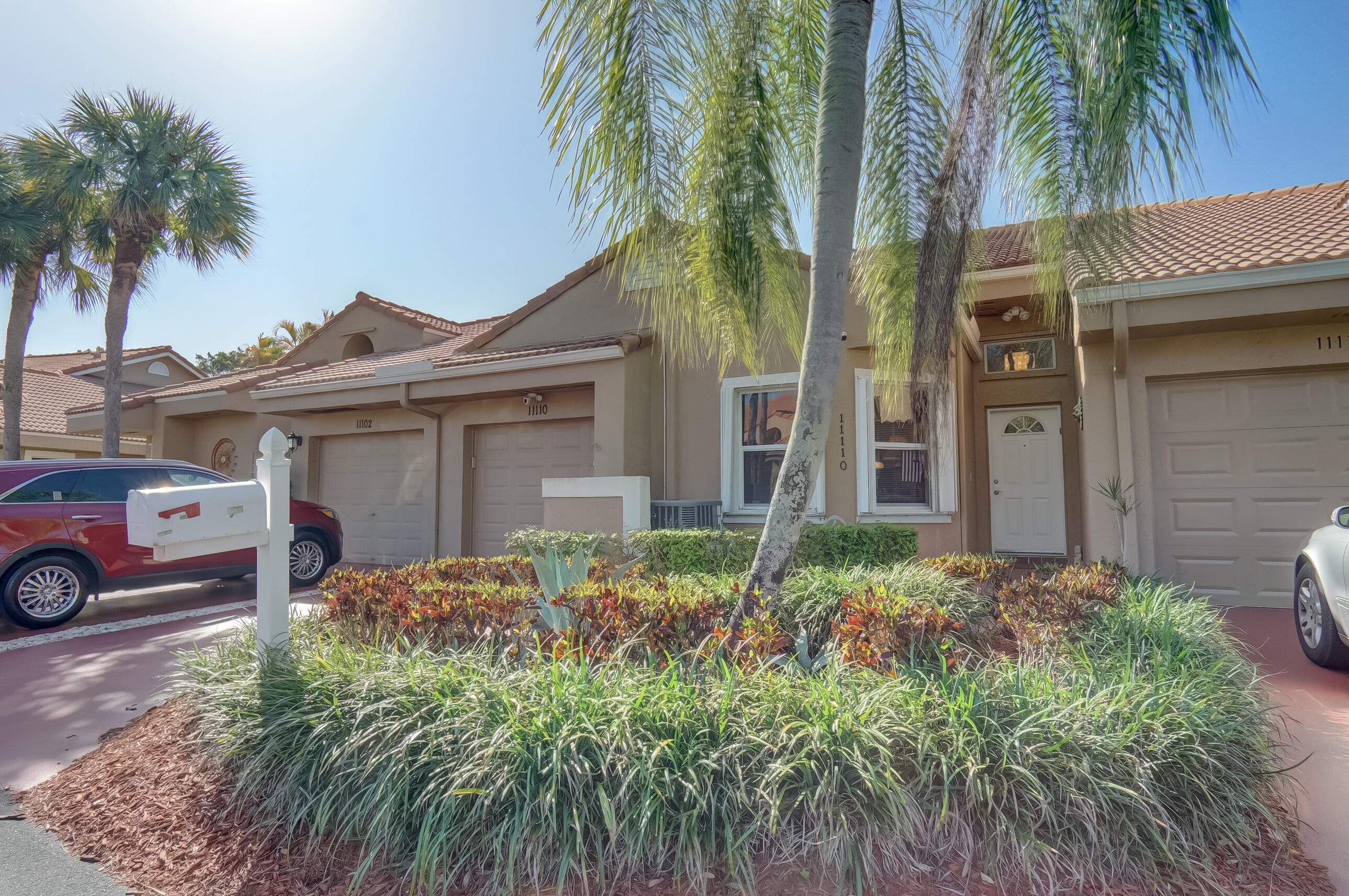 11110 Autoro Court Boca Raton, FL 33498 - Photo 1 of 24 front view of a house with a garden