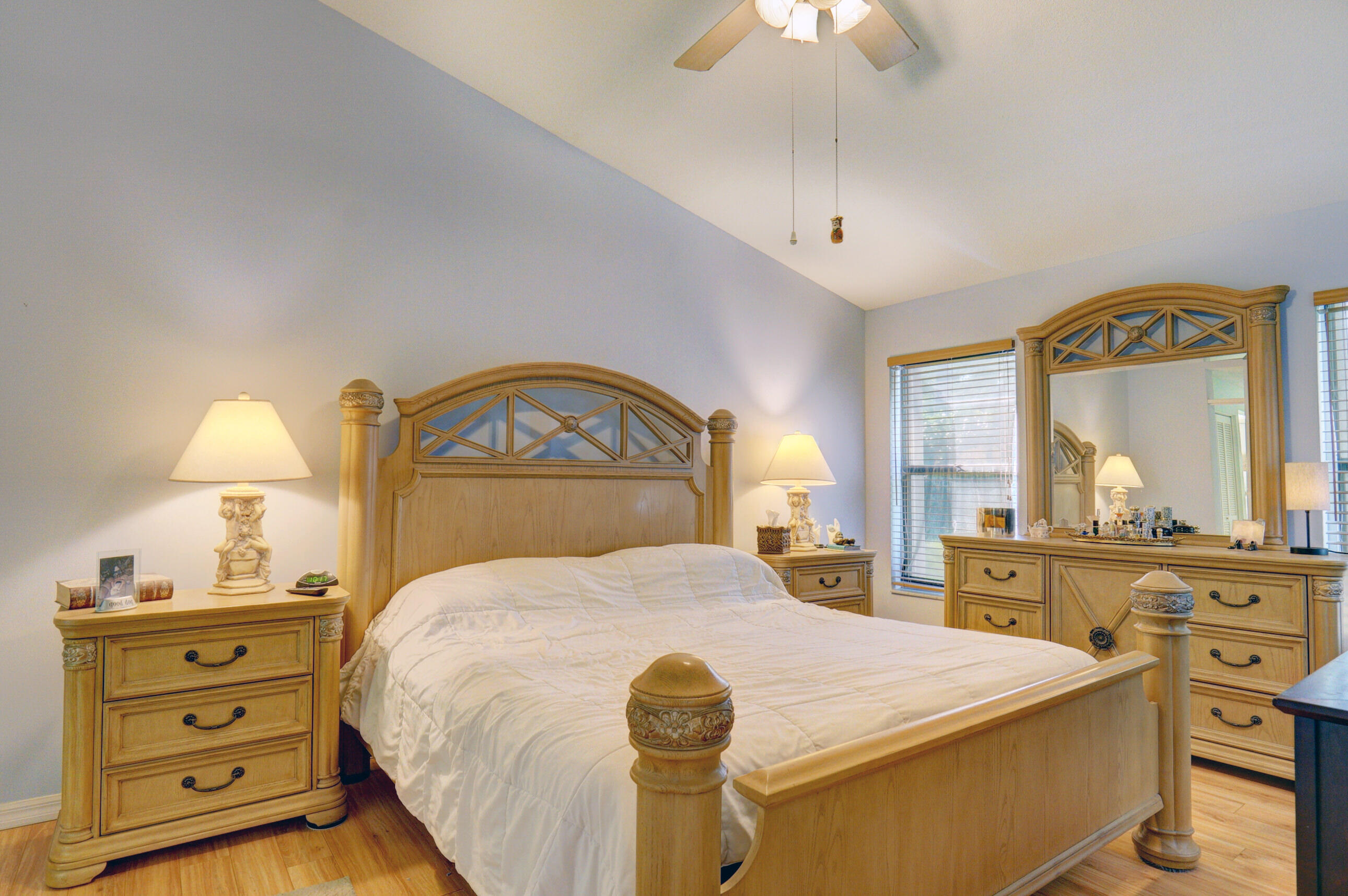 11110 Autoro Court Boca Raton, FL 33498 - Photo 13 of 24 a bedroom with a bed and a dresser in it