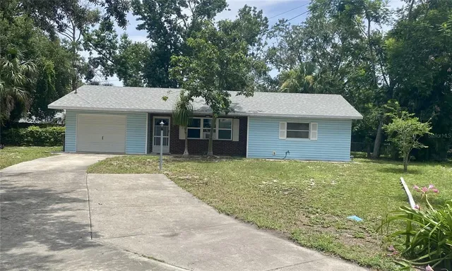 front view of a house with a garden