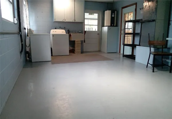 a view of room with furniture and a window