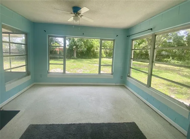 a view of an empty room with a window