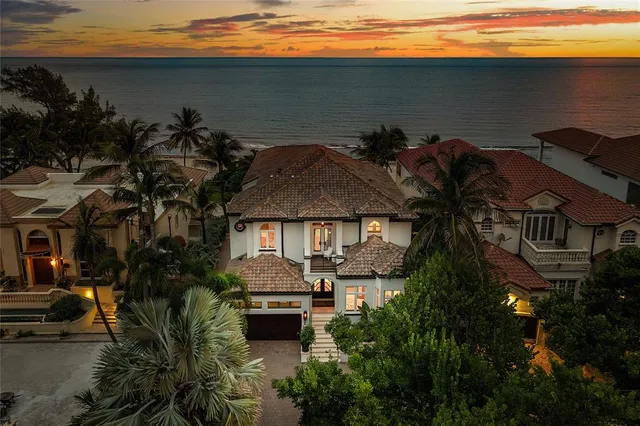 a view of multiple houses with a lake view