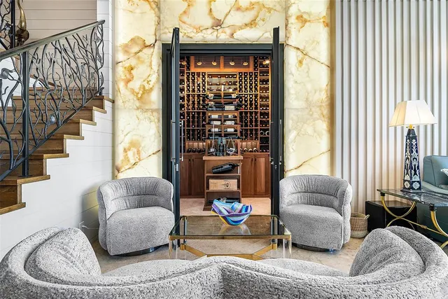 a spacious bedroom with a large bed and a couch