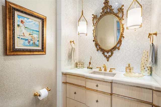 a bathroom with a sink mirror toilet and shower