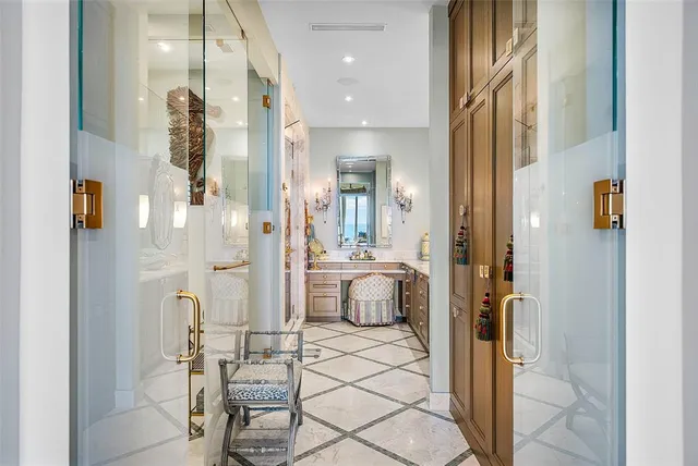 a kitchen with stainless steel appliances granite countertop a refrigerator and cabinets