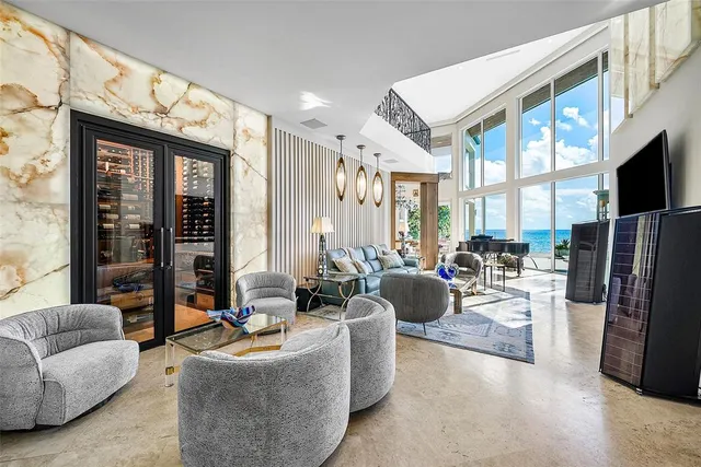 a view of a dining room with furniture wooden floor and chandelier