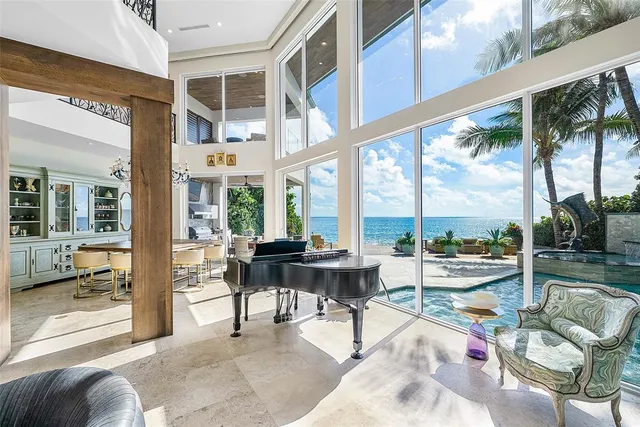 a view of a patio with table and chairs and potted plants