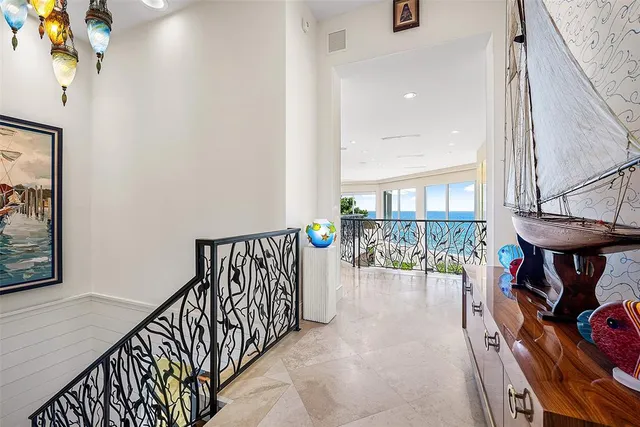 a living room with furniture and a book shelf