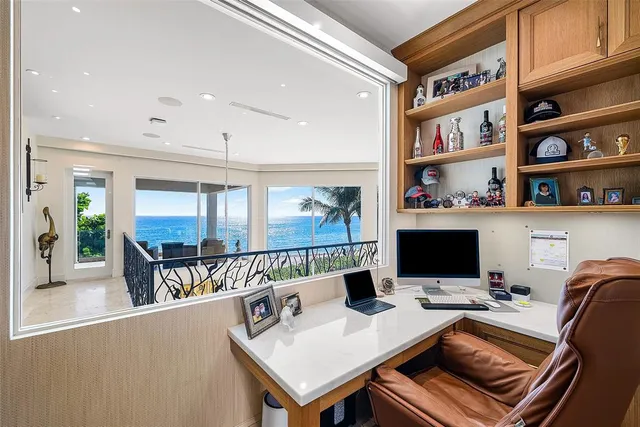 a living room with furniture and floor to ceiling window