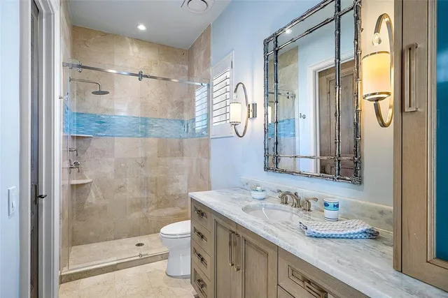 a front view of a house with yard and trees