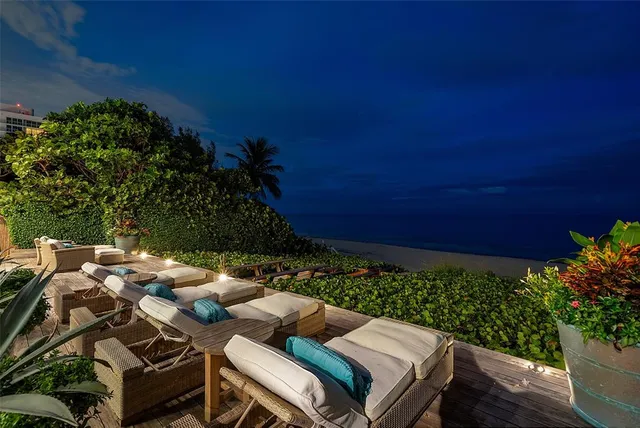 a view of an outdoor dining space with furniture