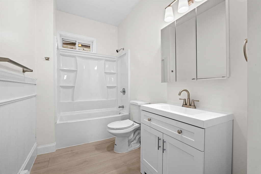 36 Elm Hill Park, Unit 1F Boston, MA 02121 - Photo 12 of 23 a bathroom with a sink a toilet and shower