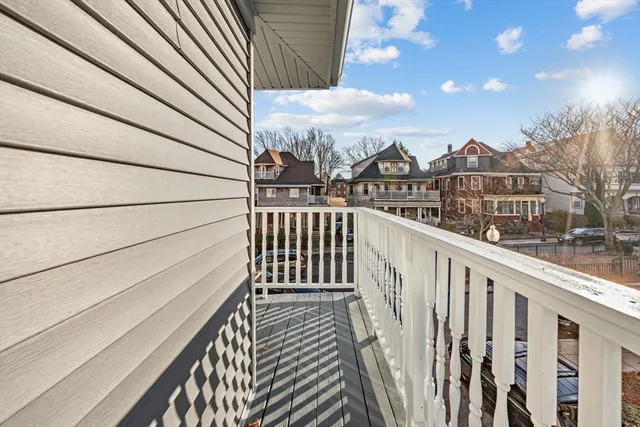 a view of a balcony with wooden fence