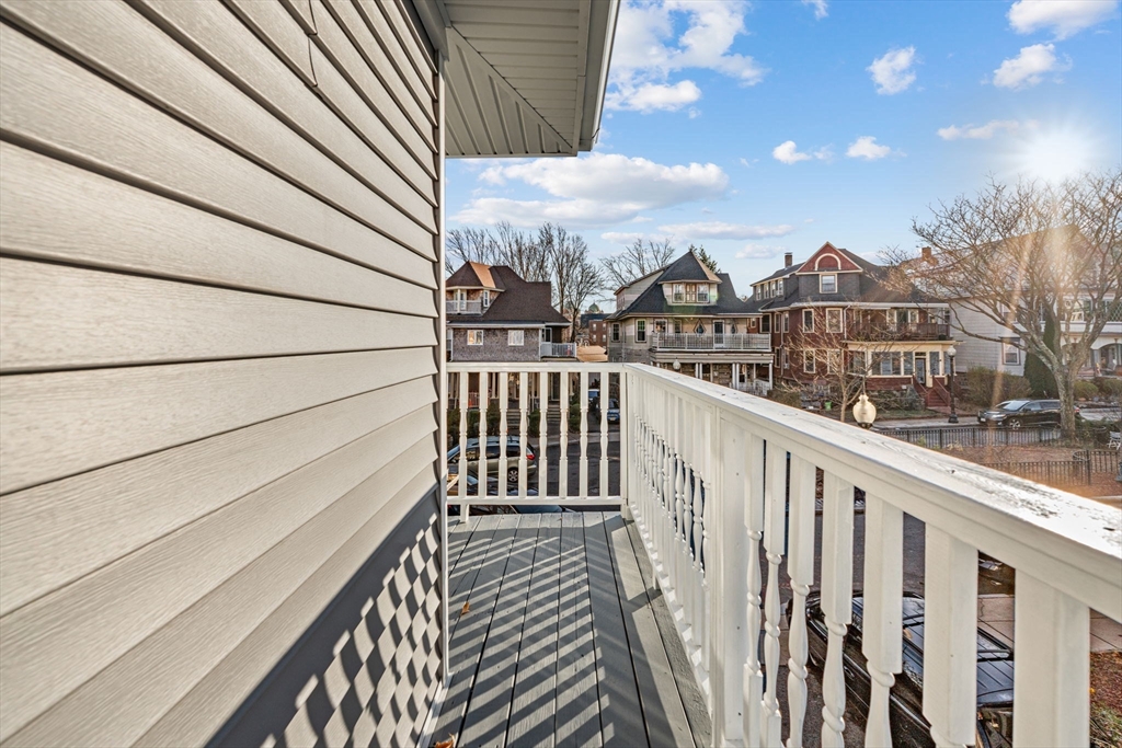 36 Elm Hill Park, Unit 1F Boston, MA 02121 - Photo 18 of 23 a view of a balcony with wooden fence