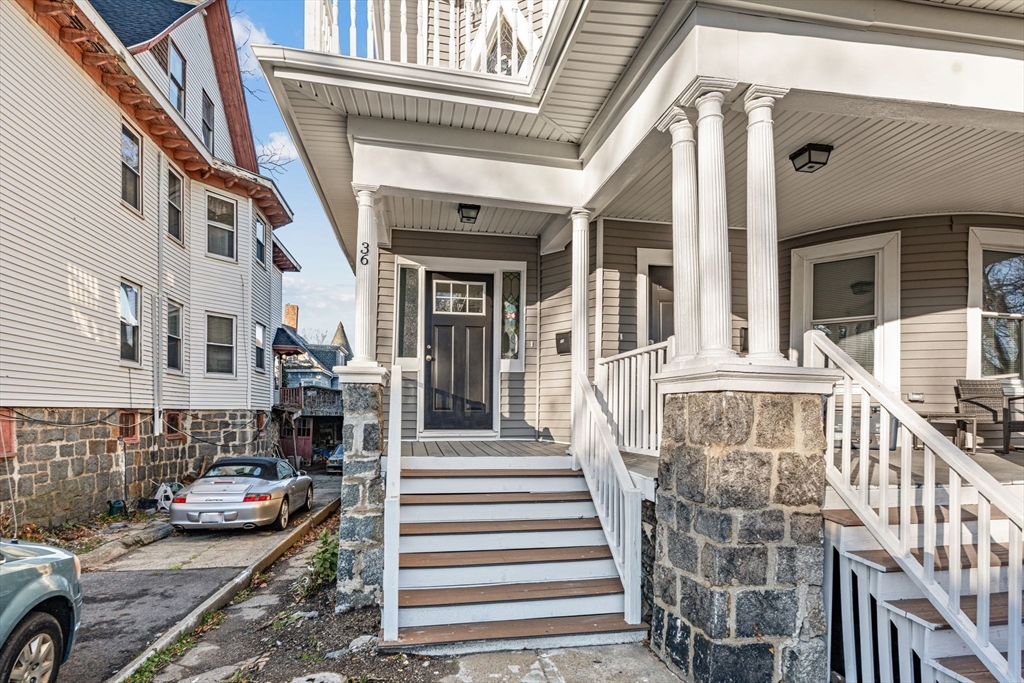 36 Elm Hill Park, Unit 1F Boston, MA 02121 - Photo 23 of 23 a view of a building with car parked