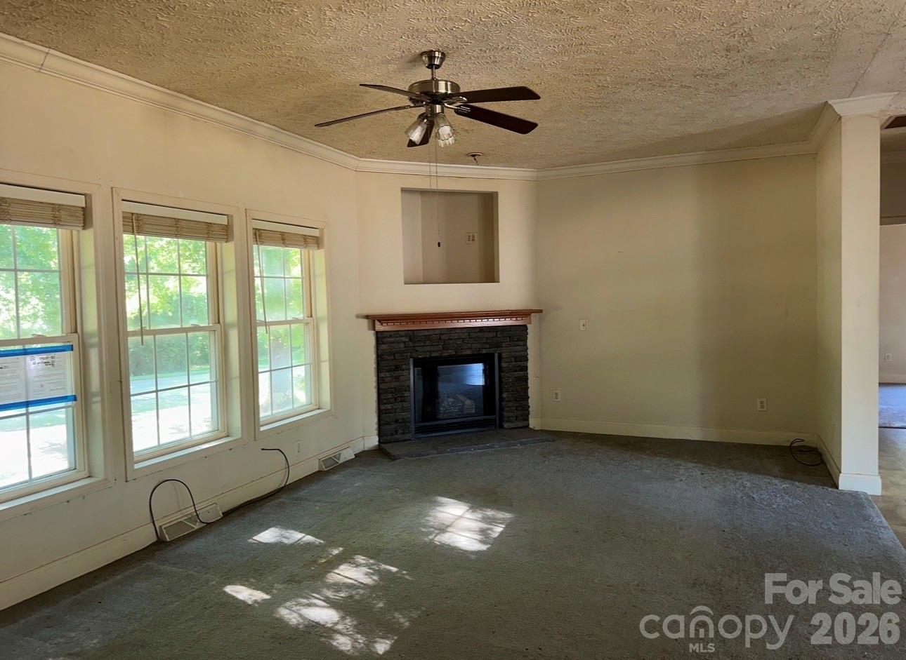172 Jesse King Road Advance, NC 27006 - Photo 12 of 23 a view of a livingroom with a fireplace and window