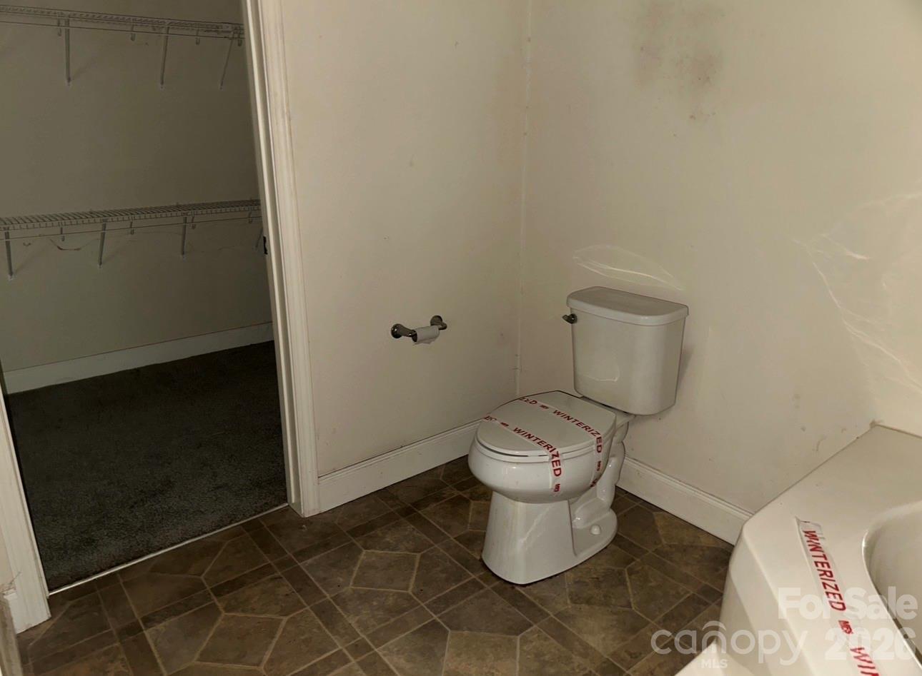 172 Jesse King Road Advance, NC 27006 - Photo 17 of 23 a white toilet sitting next to a sink