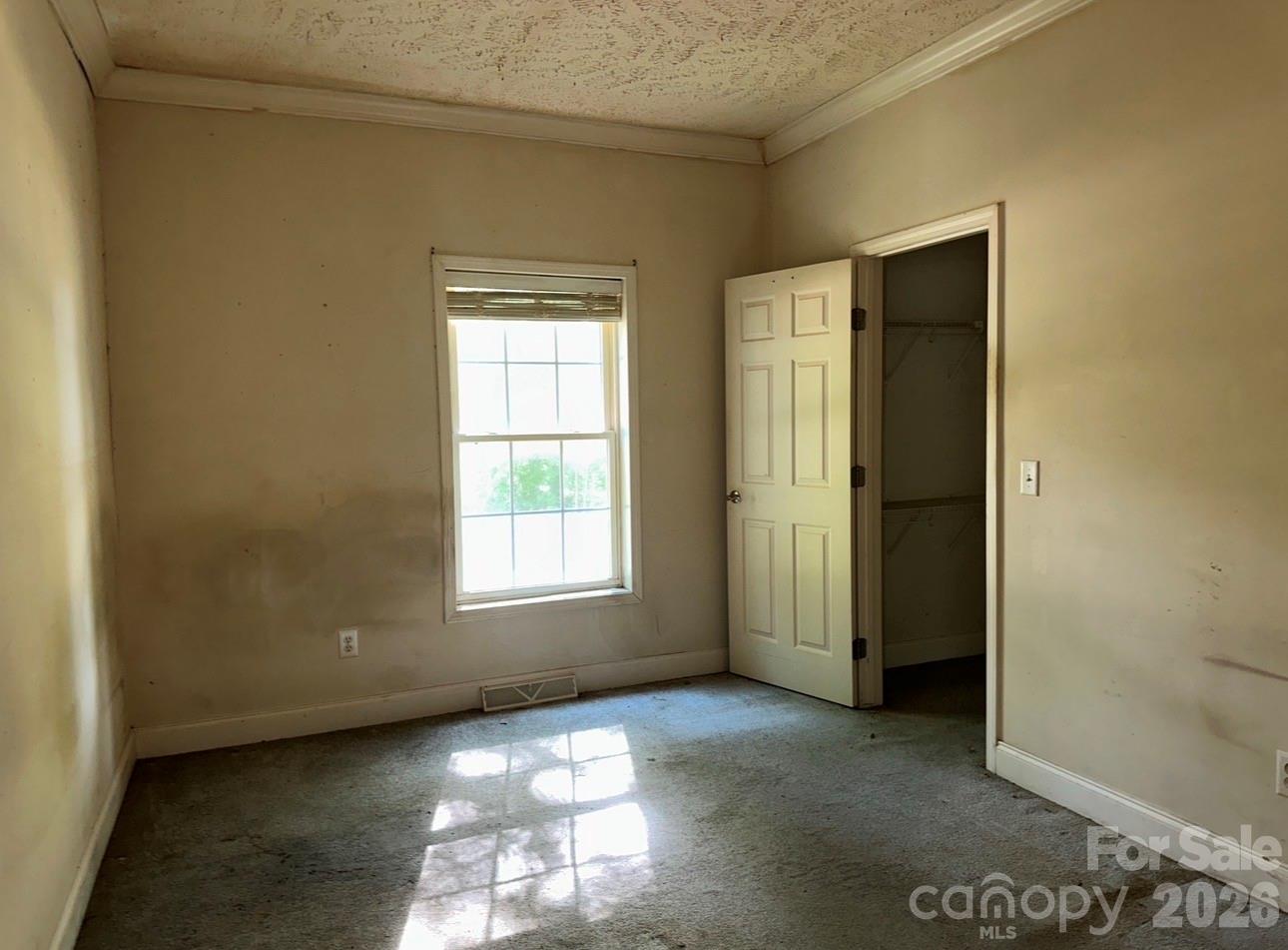 172 Jesse King Road Advance, NC 27006 - Photo 18 of 23 an empty room with windows