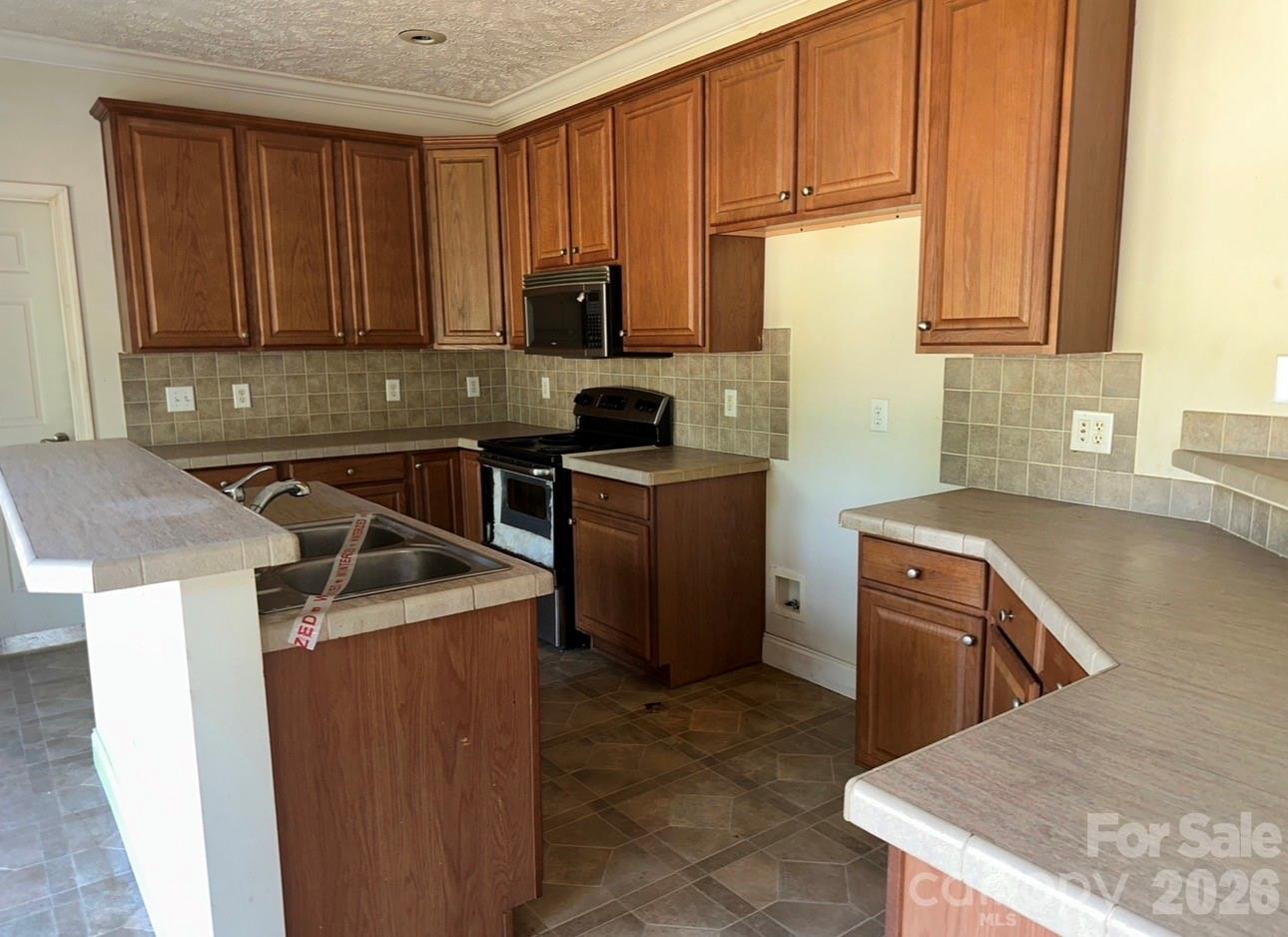 172 Jesse King Road Advance, NC 27006 - Photo 6 of 23 a kitchen with stainless steel appliances granite countertop a sink stove and refrigerator