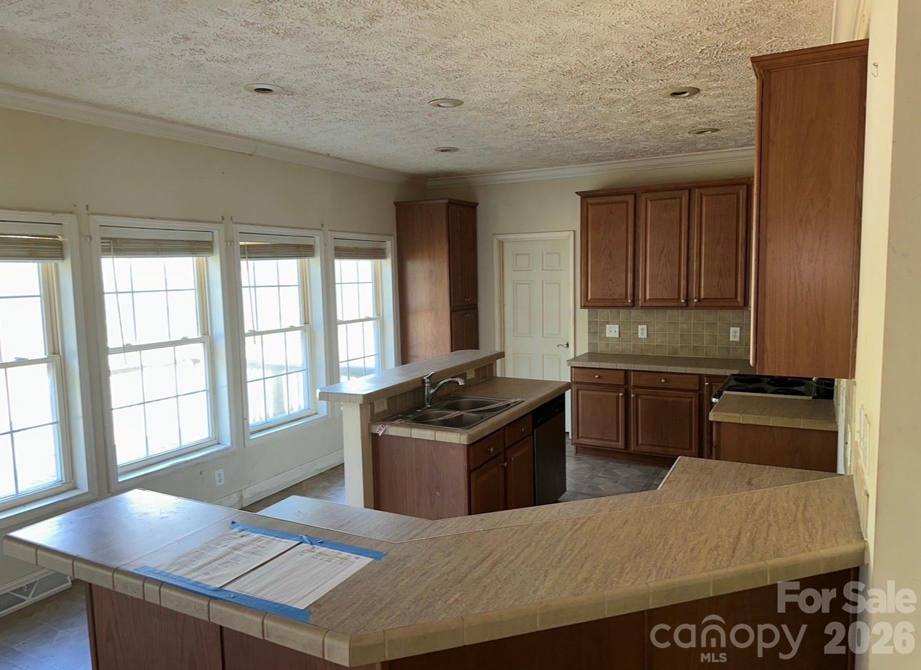 172 Jesse King Road Advance, NC 27006 - Photo 8 of 23 a kitchen with granite countertop a stove and a refrigerator