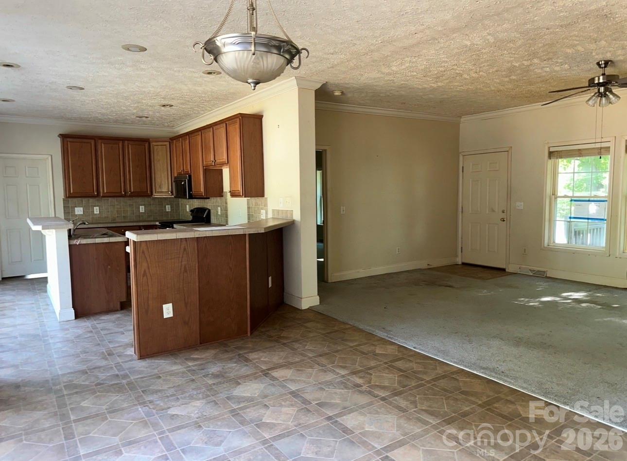 172 Jesse King Road Advance, NC 27006 - Photo 9 of 23 a view of a kitchen with a sink cabinets and window