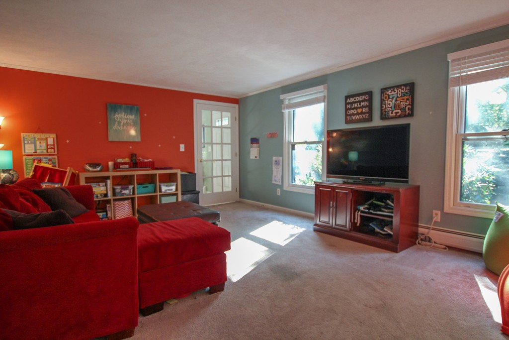 19 Coleman Road Newbury, MA 01922 - Photo 11 of 29 a living room with furniture and a flat screen tv
