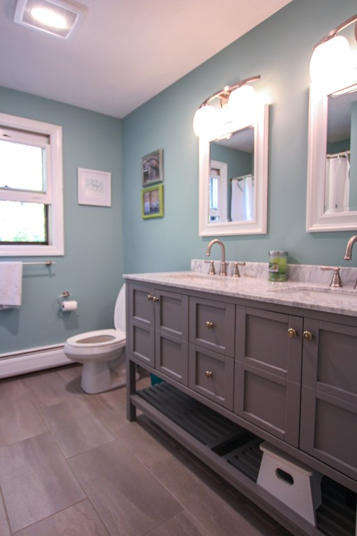 19 Coleman Road Newbury, MA 01922 - Photo 15 of 29 a bathroom with a toilet a sink and mirror