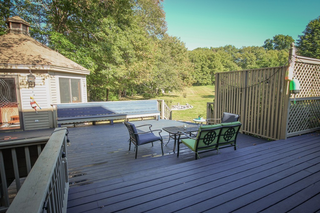 19 Coleman Road Newbury, MA 01922 - Photo 23 of 29 a view of deck with table and chairs and wooden floor