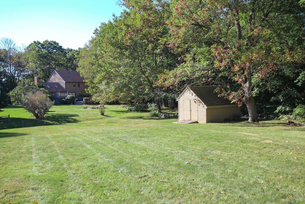 19 Coleman Road Newbury, MA 01922 - Photo 28 of 29 a front view of a house with a yard and trees