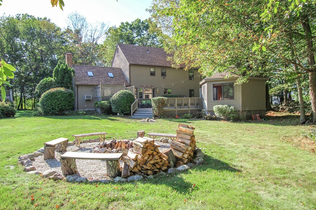 19 Coleman Road Newbury, MA 01922 - Photo 3 of 29 a view of a house with backyard sitting area and garden