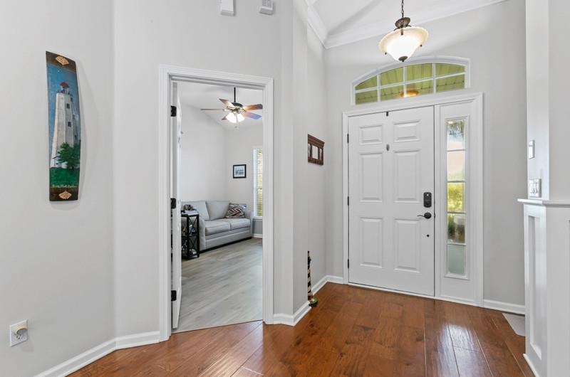 2724 North Portofino Road St. Augustine, FL 32092 - Photo 12 of 86 Entryway featuring dark wood finished floors and ceiling fan