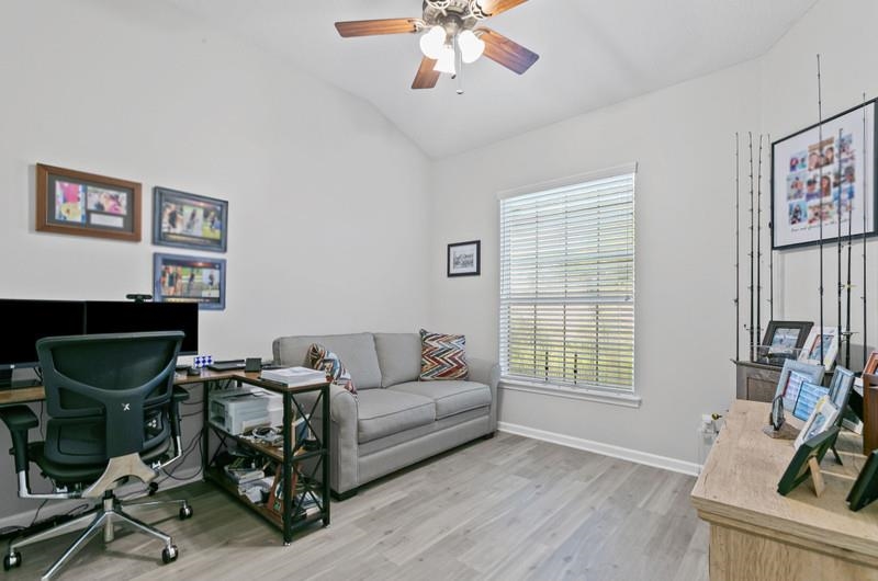 2724 North Portofino Road St. Augustine, FL 32092 - Photo 13 of 86 a living room with furniture a window and a flat screen tv