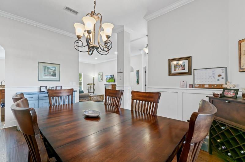 2724 North Portofino Road St. Augustine, FL 32092 - Photo 16 of 86 a view of a dining room with furniture window and wooden floor