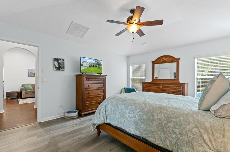 2724 North Portofino Road St. Augustine, FL 32092 - Photo 22 of 86 Bedroom with wood finished floors and ceiling fan