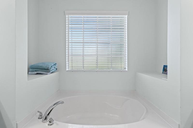 2724 North Portofino Road St. Augustine, FL 32092 - Photo 25 of 86 a white bath tub sitting next to a window