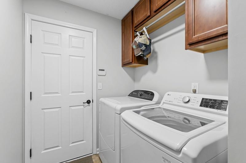 2724 North Portofino Road St. Augustine, FL 32092 - Photo 28 of 86 Laundry room with washing machine and dryer and cabinet space