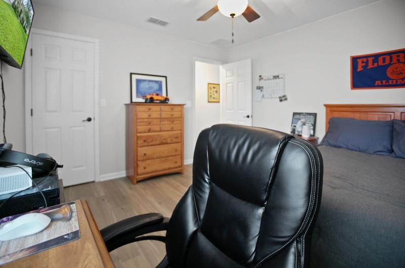 2724 North Portofino Road St. Augustine, FL 32092 - Photo 30 of 86 Bedroom featuring an office area, wood finished floors, and ceiling fan