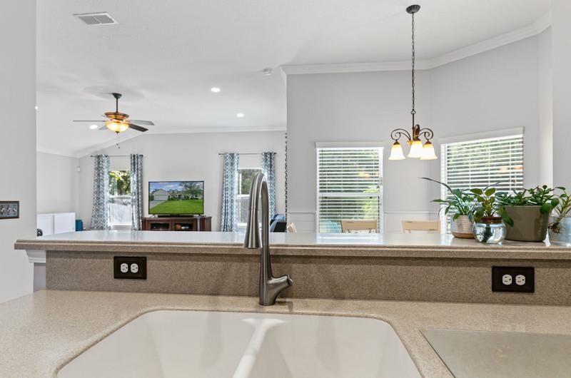 2724 North Portofino Road St. Augustine, FL 32092 - Photo 86 of 86 a bathroom with a tub a potted plant and a sink