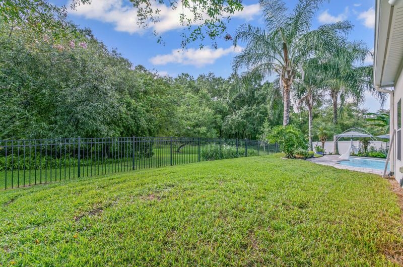2724 North Portofino Road St. Augustine, FL 32092 - Photo 54 of 86 Fenced backyard featuring a patio area