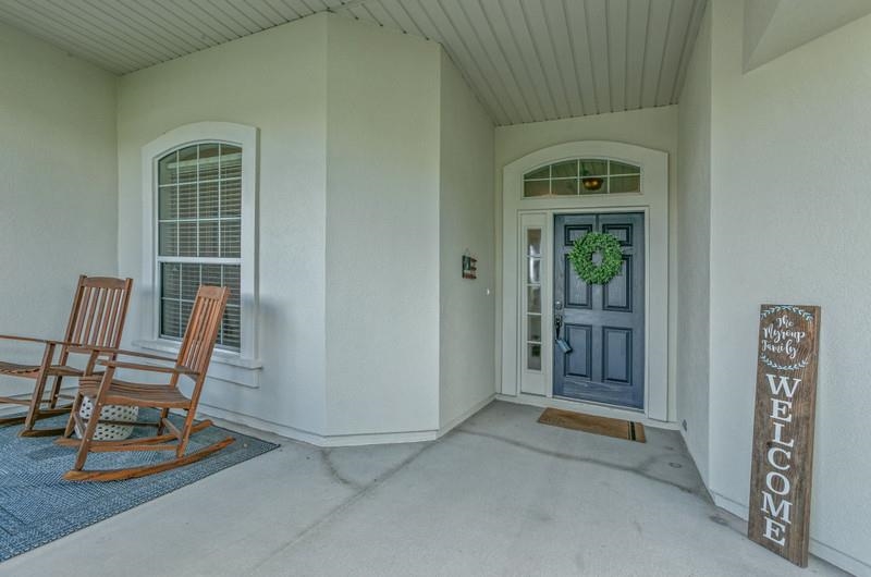 2724 North Portofino Road St. Augustine, FL 32092 - Photo 6 of 86 a view of a livingroom with furniture and front door